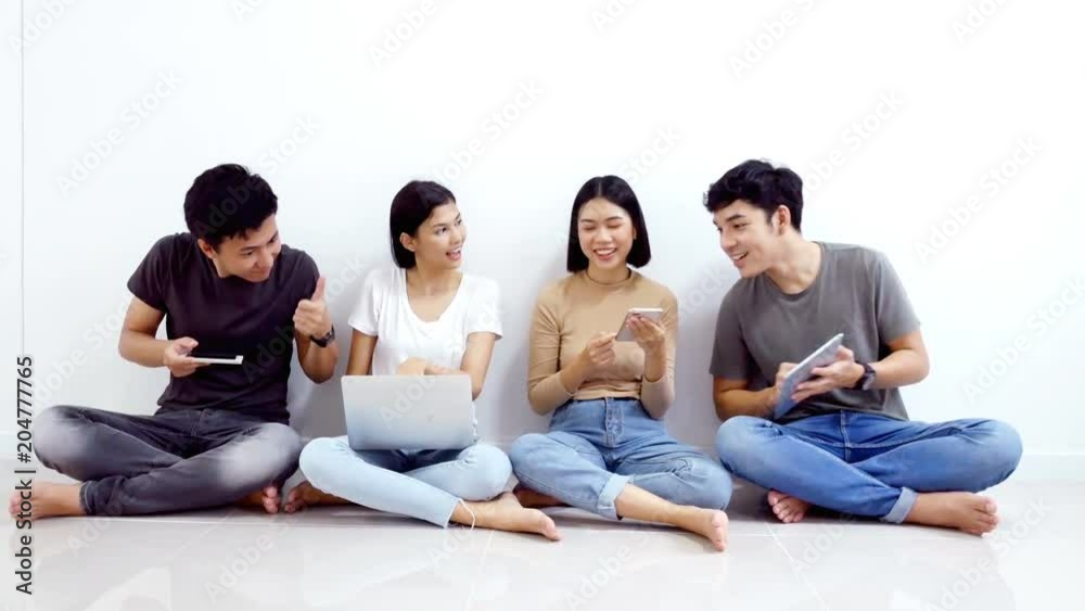 Asian people using modern technology with happy emotion together . People lifestyle concept. Asian people using modern technology with happy emotion together . People lifestyle concept.