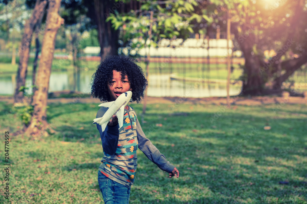 The boy is playing the plane. Soft focus concept. The boy is playing the plane. Soft focus concept.