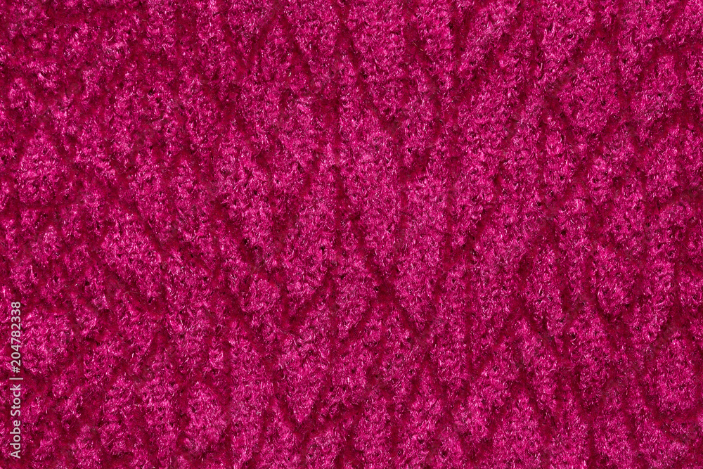 Saturated pink fabric texture with ornament.