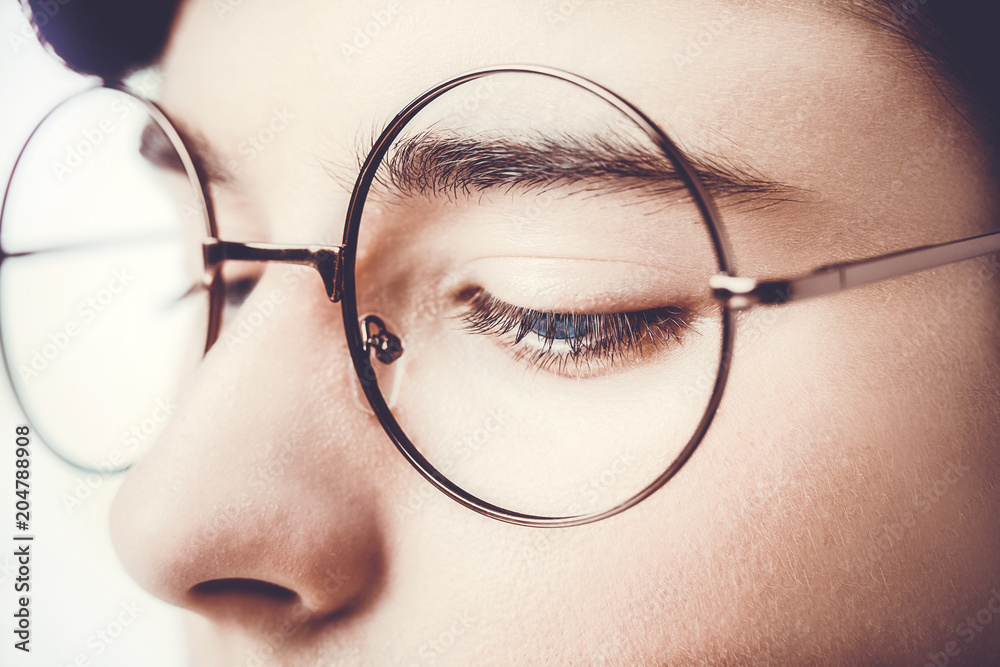 Portrait of a boy wearing eyeglasses blue eyes close, macro studio shot. Portrait of a boy wearing eyeglasses blue eyes close, macro studio shot.