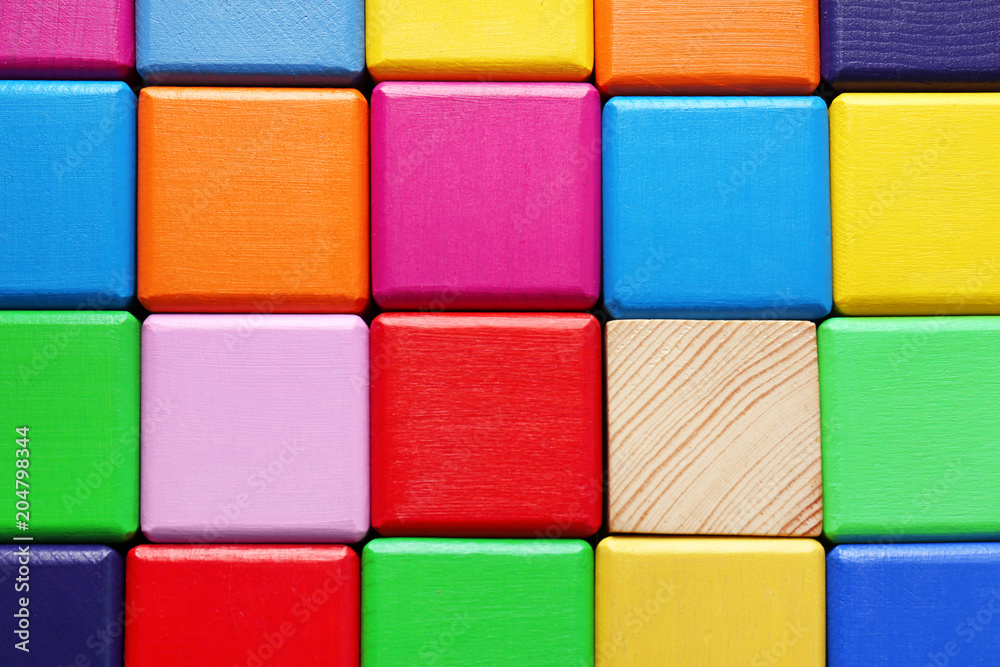 Wooden cubes and one different, closeup