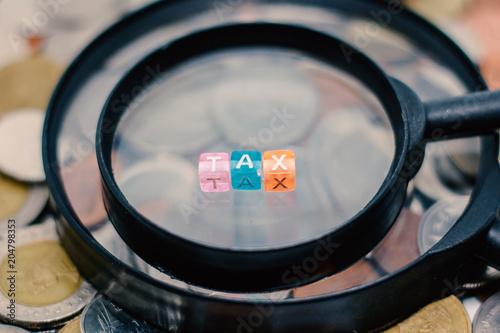 TAX word on the magnifying ...