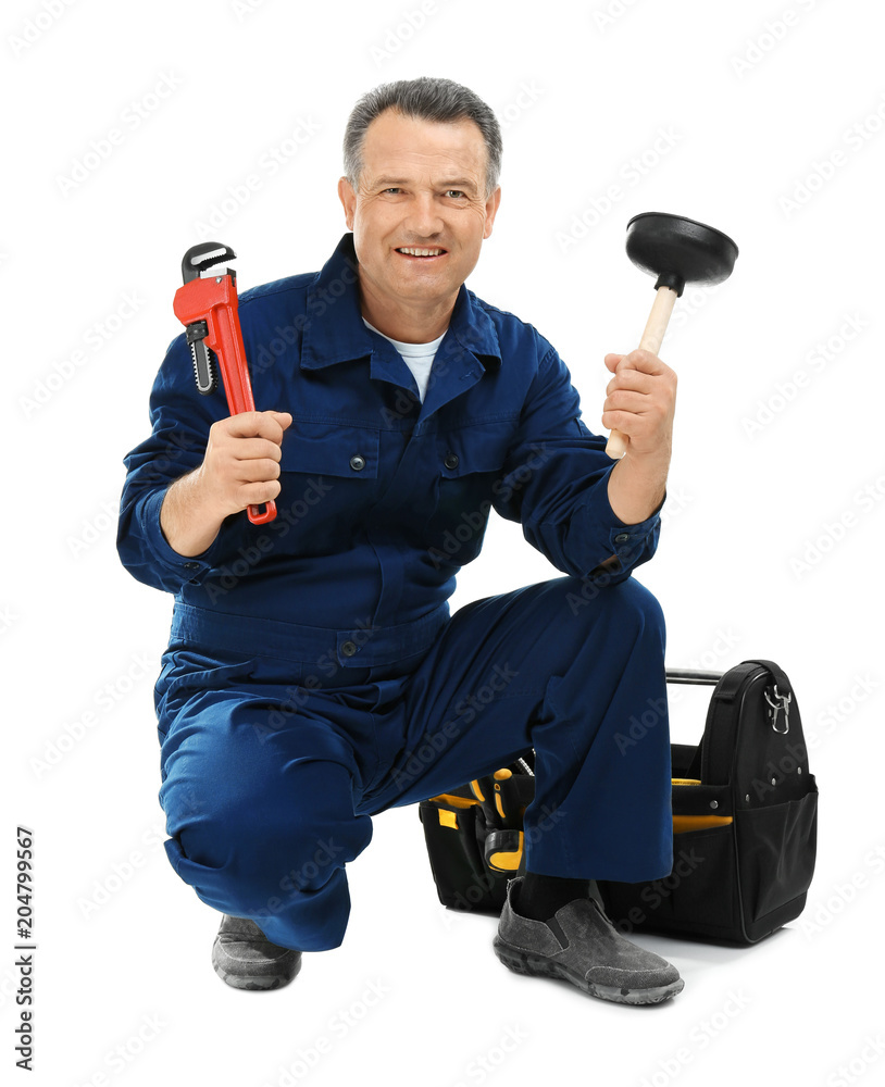 Mature plumber with pipe wrench and force cup on white background Mature plumber with pipe wrench and force cup on white background