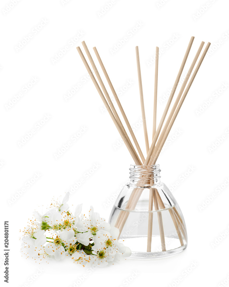 Aromatic reed freshener and flowers on white background Aromatic reed freshener and flowers on white background