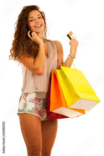 Attractive young caucasian woman with shopping bags isolated over white background