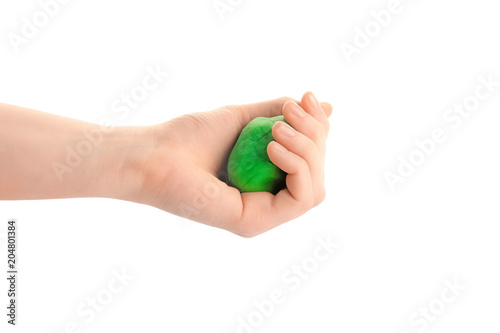 Woman holding colorful play dough on white background