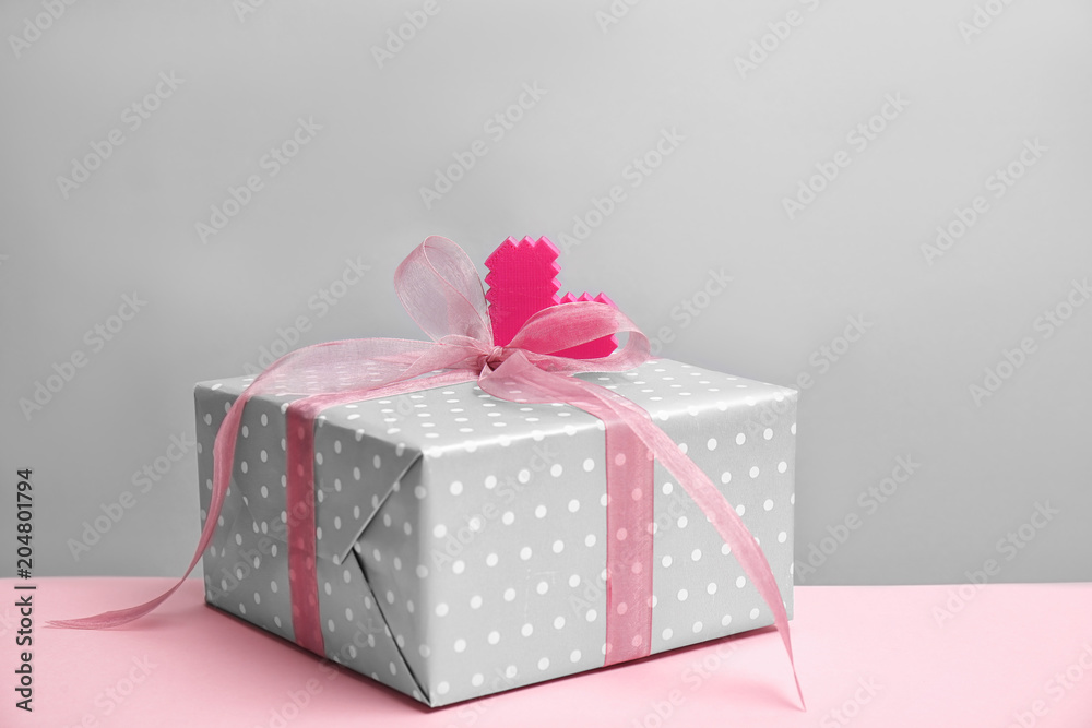 Elegant gift box for Mother's Day on table Elegant gift box for Mother's Day on table