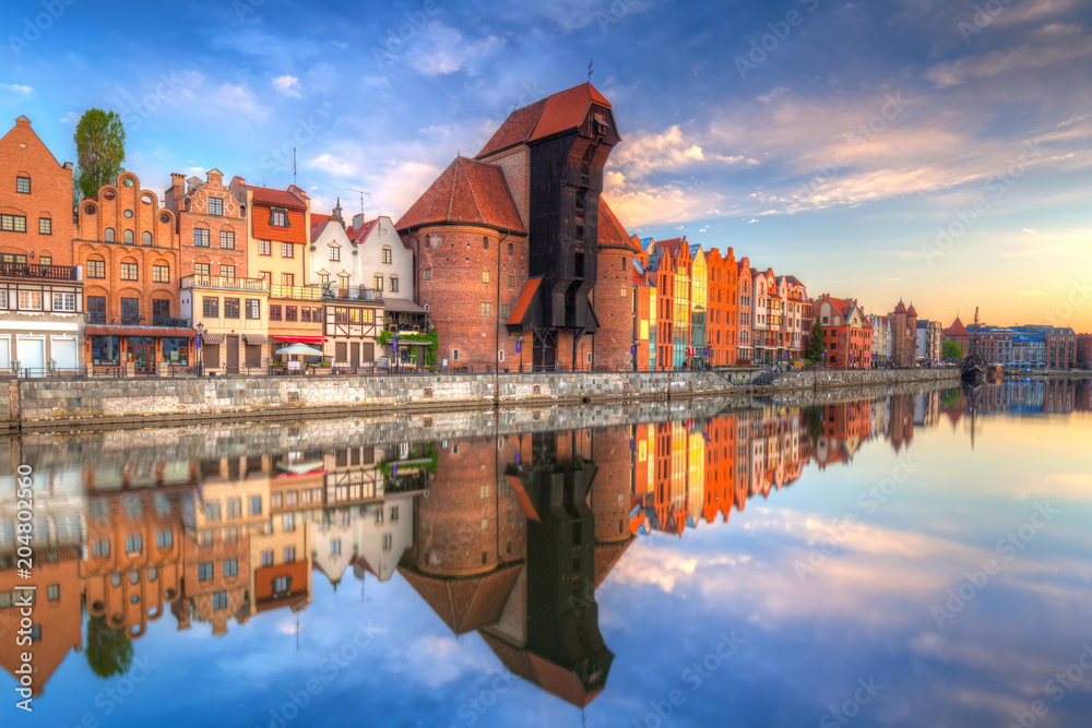 Beautiful old town of Gdansk reflected in Motlawa river at sunrise, Poland.
