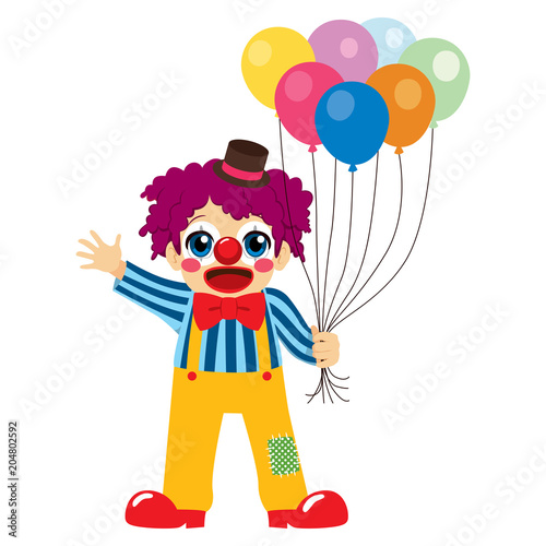 Cute little boy clown holding colorful balloons waving hand and happy face expression