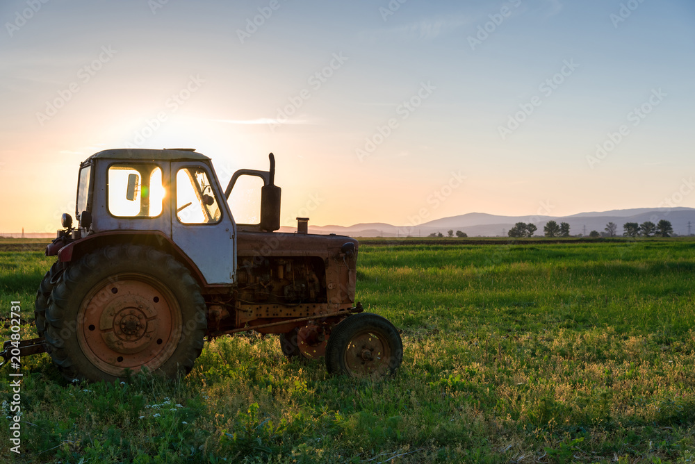Tractor plowing fields.