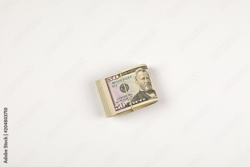 Stack of USA 50 dollars isolated on white background. Stack of USA 50 dollars isolated on white background.