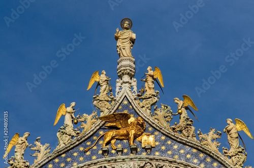 Details and statue on Basilica of St. Mark in Venice, Italy