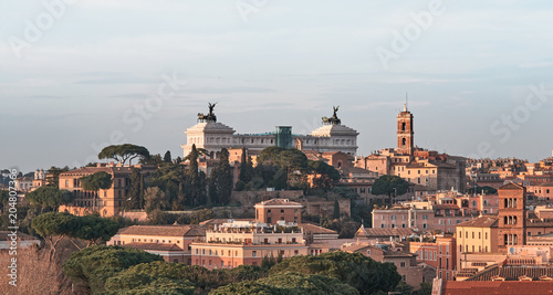 View of Rome roofs: Altar of the Fatherland monument to Vittorio Emanuele, Trajan tower