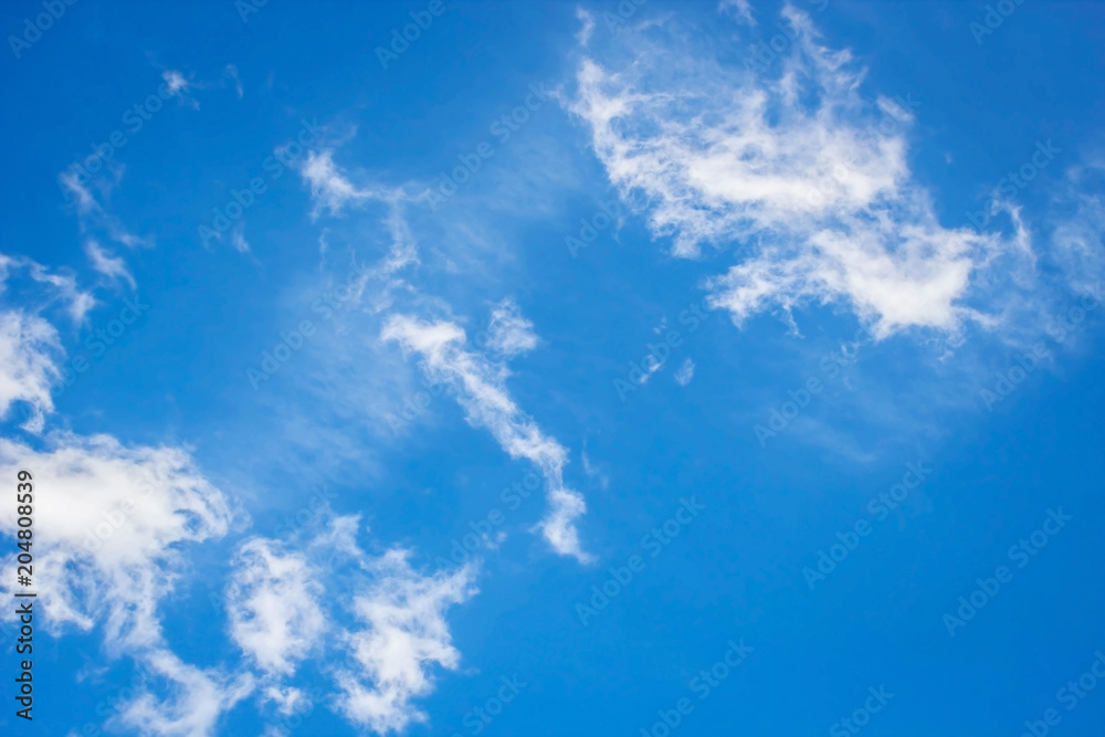 white fluffy clouds in the blue sky background white fluffy clouds in the blue sky background