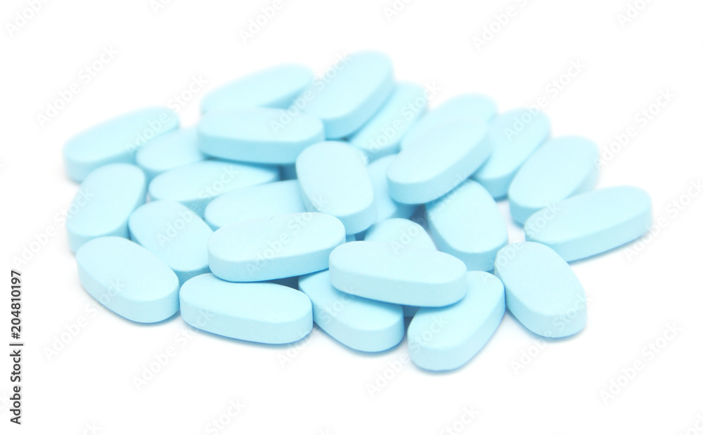blue pills, capsules, tablets on white blue pills, capsules, tablets on white