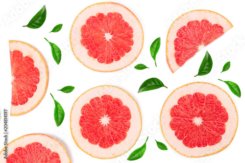 Grapefruit slices decorated with green leaves isolated on white background. Top view. Flat lay pattern