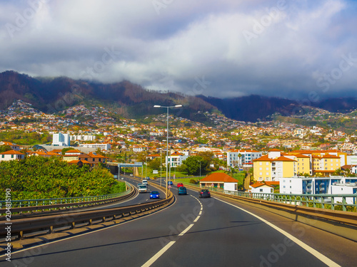 Traveling scene on the road in Funchal capital, Madeira island © cristianbalate