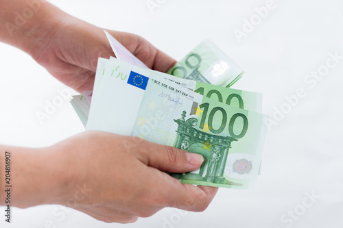 Euro banknotes of hands