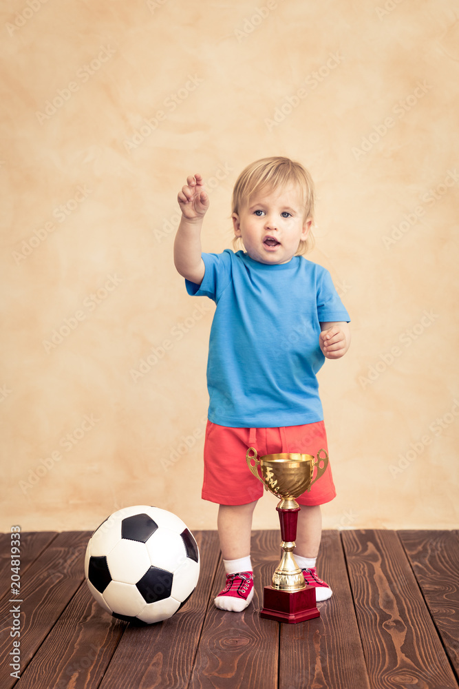 Child is pretending to be a soccer player Child is pretending to be a soccer player