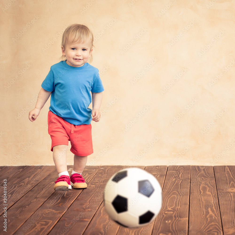 Child is pretending to be a soccer player Child is pretending to be a soccer player