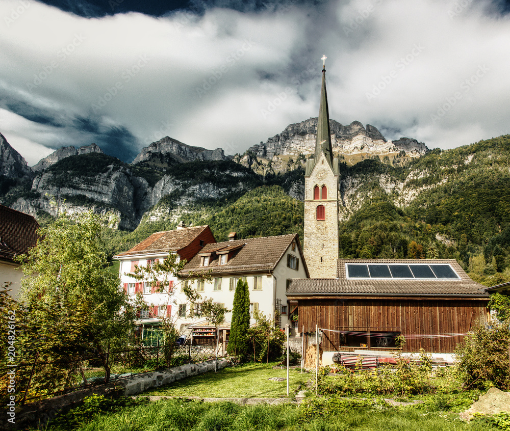 Catholic Church in Walenstadt, with Churfirsten as backdrop Catholic Church in Walenstadt, with Churfirsten as backdrop