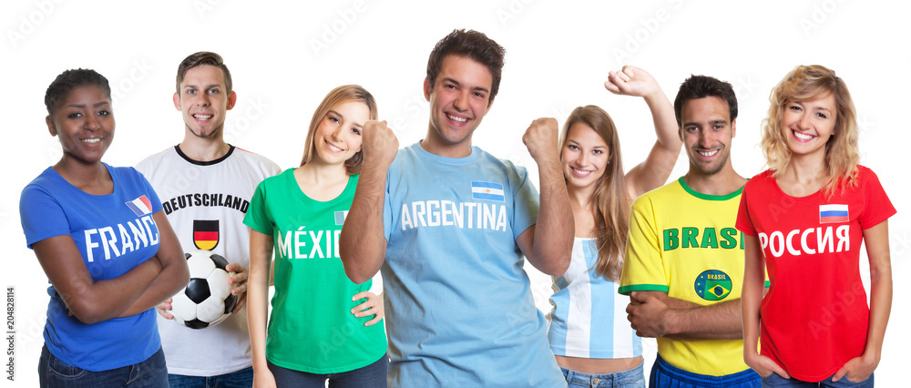 Cheering argentinian soccer fan with ball and cheering group of other fans Cheering argentinian soccer fan with ball and cheering group of other fans