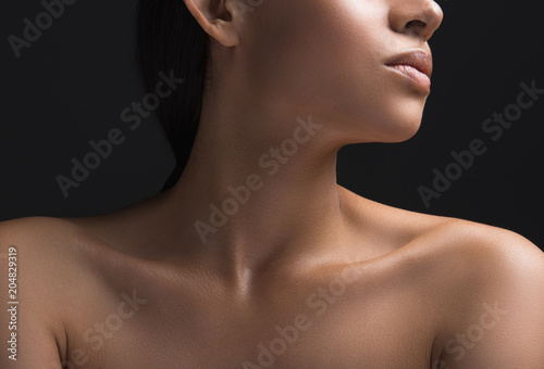 Close up of woman ideal naked pelt. Isolated on black background photo