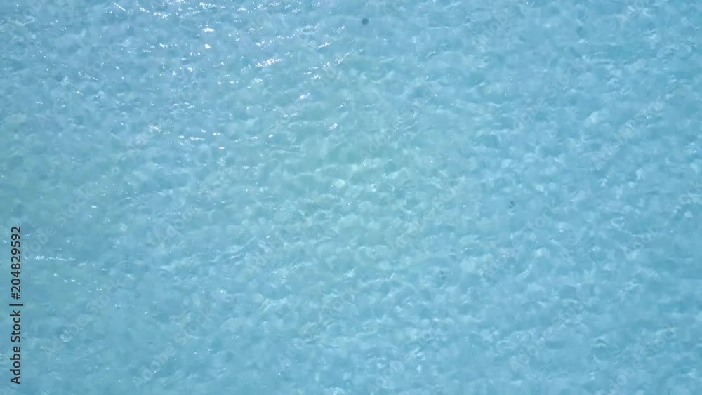 Aerial drone shot. A view of the corals from a bird's eye view. The camera looks down. Turquoise water of the Caribbean Sea. Riviera Maya Mexico. Aerial drone shot. A view of the corals from a bird's eye view. The camera looks down. Turquoise water of the Caribbean Sea. Riviera Maya Mexico.