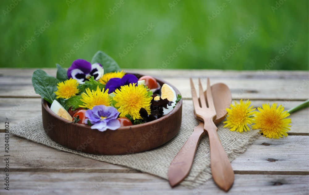 organic salad with flowers, close up. salad of dandelions with vegetables and eggs organic salad with flowers, close up. salad of dandelions with vegetables and eggs