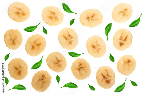 banana sliced decorated with green leaves isolated on white background. Top view. Flat lay