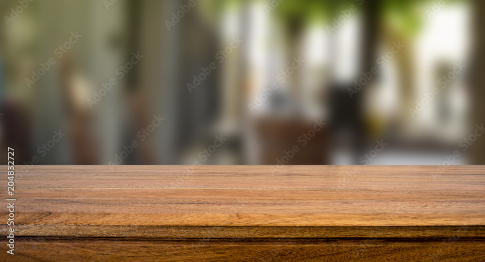 Wooden board empty table blur in coffee shop