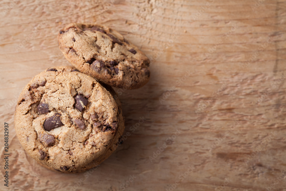 Cookies with chocolate chips on a wooden table. Top view with copy space Cookies with chocolate chips on a wooden table. Top view with copy space