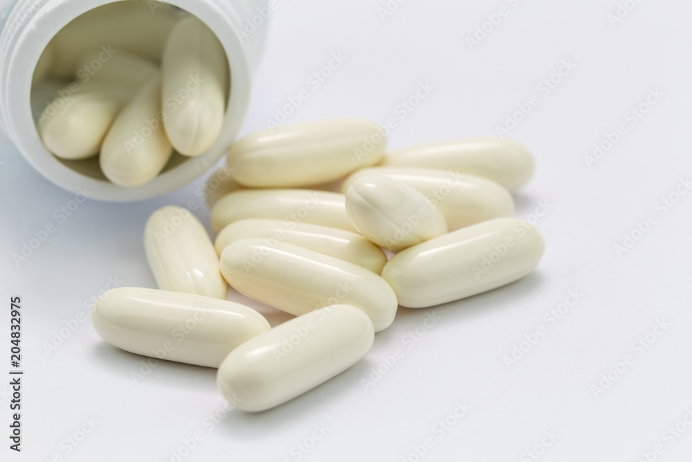 Pills and pills bottle on white background. Pills and pills bottle on white background.