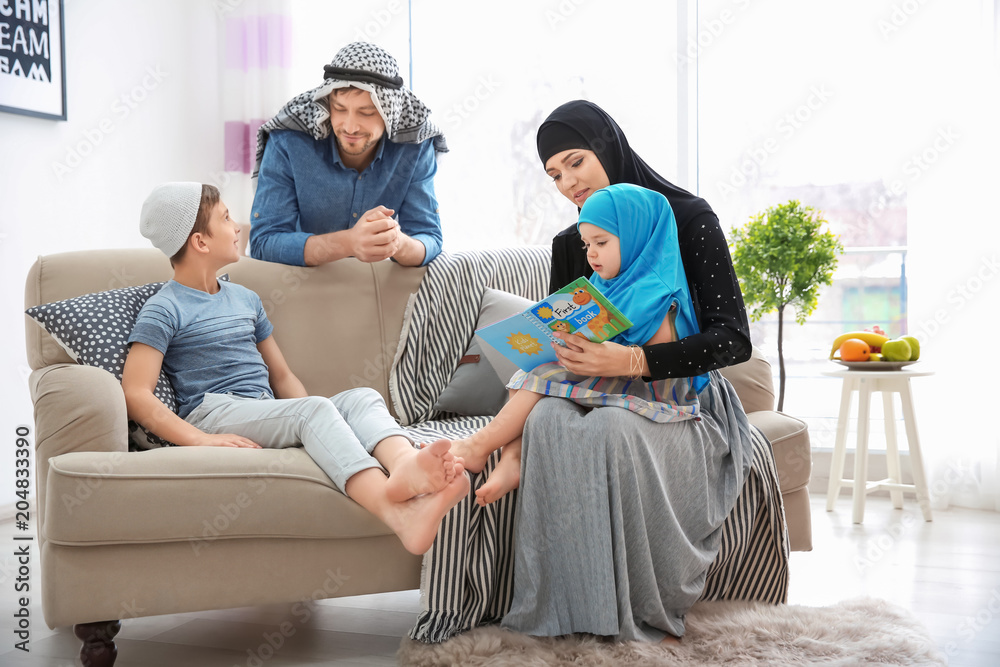 Happy Muslim family spending time together at home StockFoto Adobe Stock