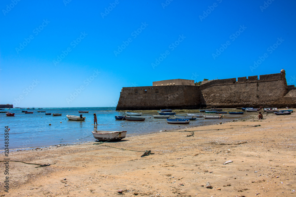 Beach. A sunny day on the beach of Cadiz. Andalusia, Spain. Picture taken – 6 may 2018. Beach. A sunny day on the beach of Cadiz. Andalusia, Spain. Picture taken – 6 may 2018.