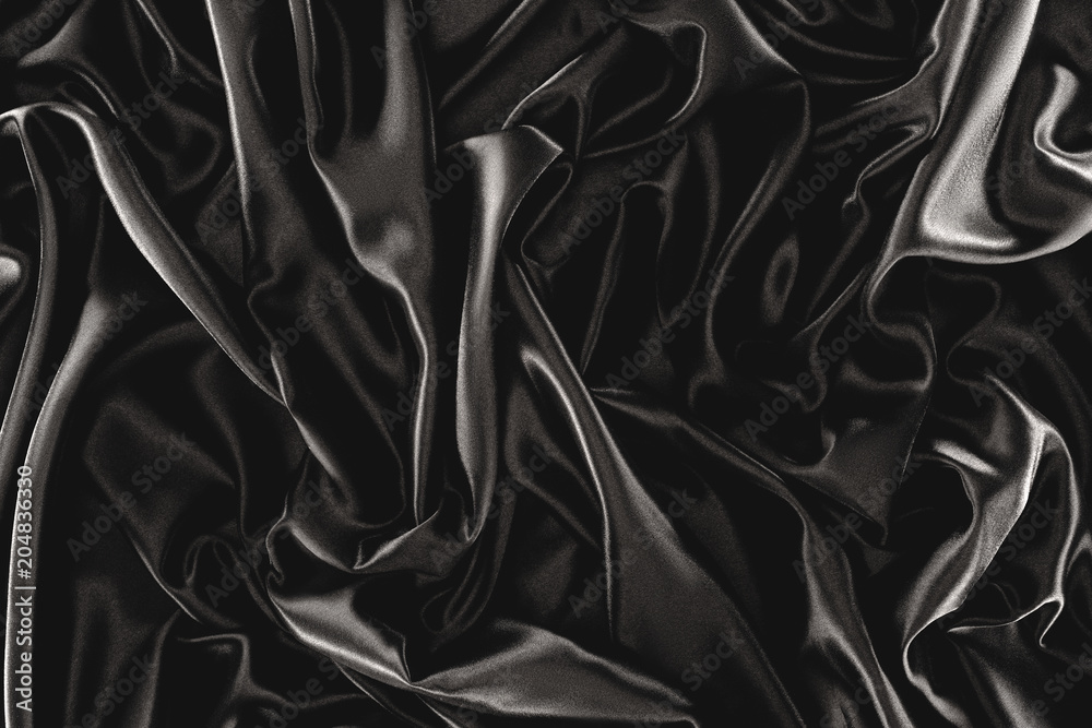 full frame of black elegant silk cloth as background