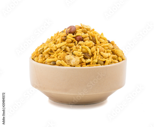 Indian Salty Snack Crunchy Mix Namkeen in bowl isolated on white Background photo
