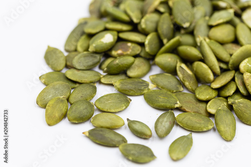 Pumpkin seeds on white background