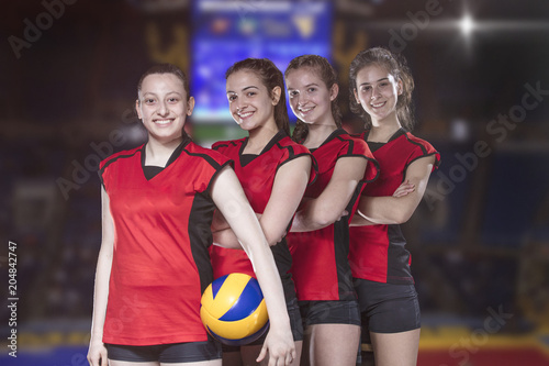 Woman volleyball Players celebrating victory and gold medal