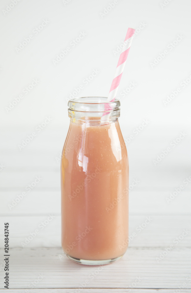 Pink Fruit Smoothy on a White Wood Table Pink Fruit Smoothy on a White Wood Table