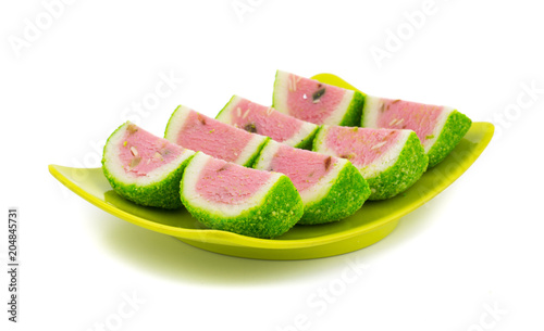 Indian Sweet Food Watermelon shaped Mawa Burfi isolated on white background photo