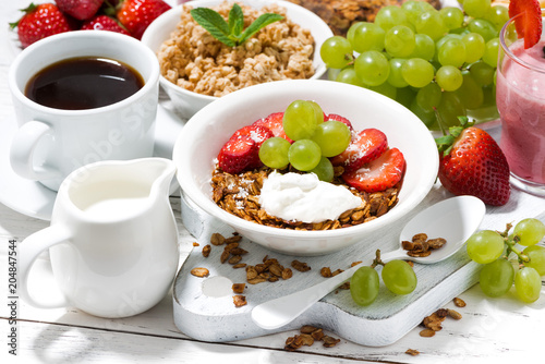 healthy breakfast with fruits, granola and milkshake