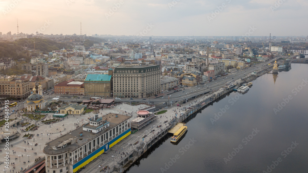 From the bird's eye view of the river station, Postal Square with St. Elijah Church , tourist boats in city Kiev