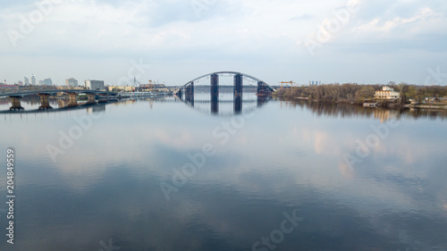 unfinished Podolsk-Voskresensky bridge connecting the Truhanov island and the Troyeschina area across the Dnipro River in Kiev photo
