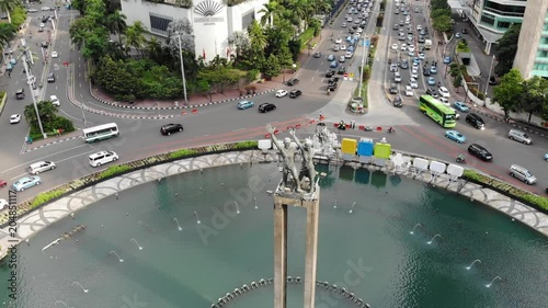 Ungraded Slow Side Panning Aerial Footage of Selamat Datang Monument in Jakarta, Indonesia.