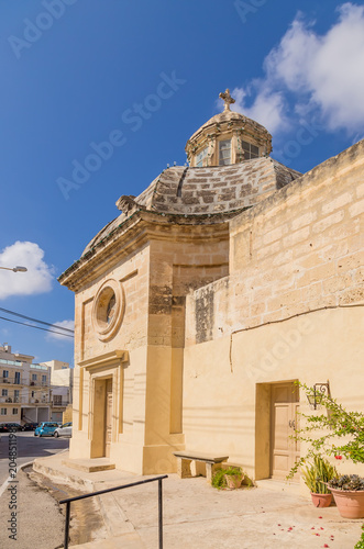 Naxxar, Malta. Side facade of the ancient chapel of St. John the Baptist photo