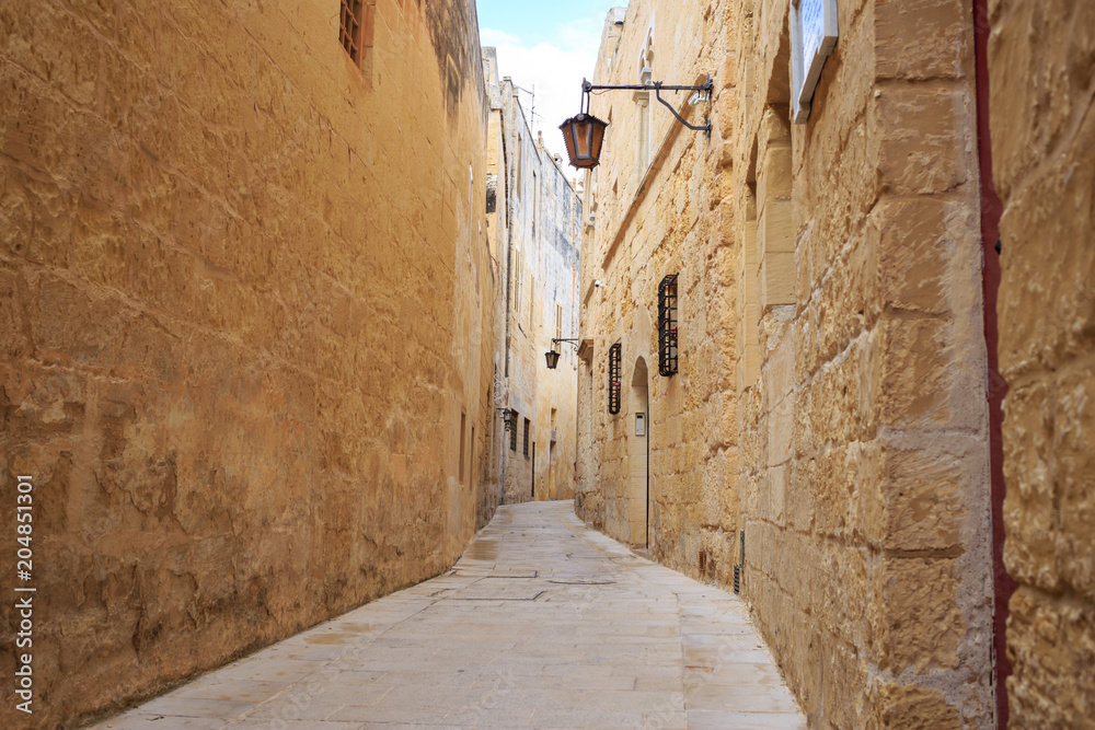 Mdina the old town with cobblestone streets, lanterns, peeled buildings, in Malta. Perfect destination for vacation and tourism.