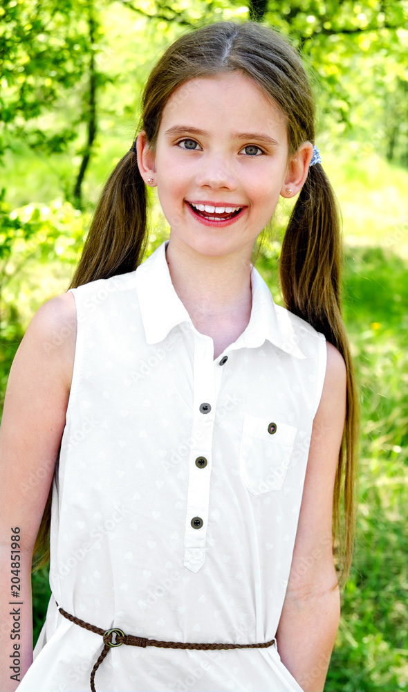 Portrait of adorable smiling little girl outdoors Portrait of adorable smiling little girl outdoors