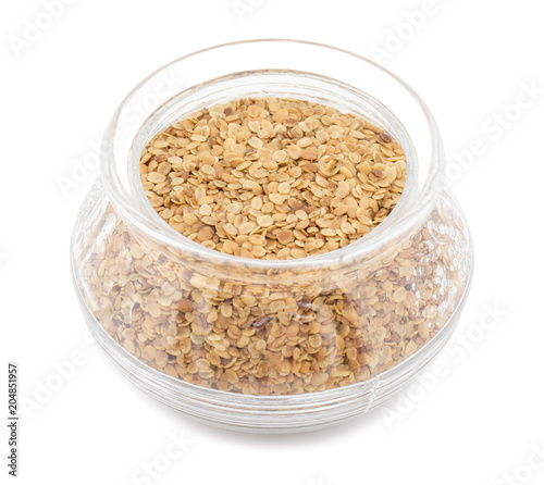 Split Roasted Coriander Seeds also know as Dhana Dal or Sukh Mukh isolated on White Background