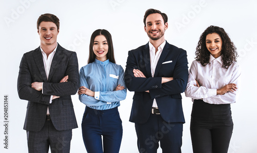 The four business people standing on the white background